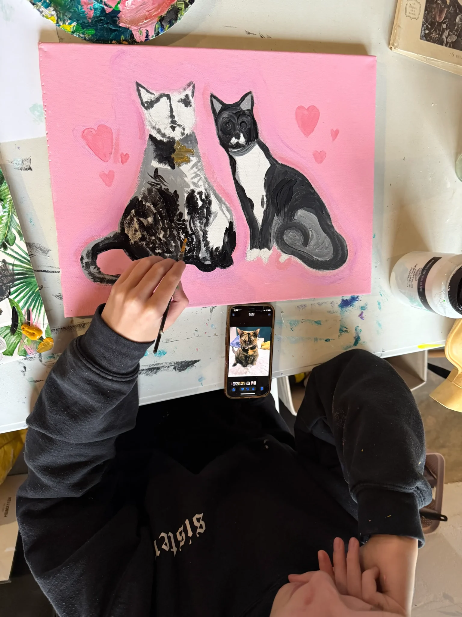 student pink painting of two cats in love