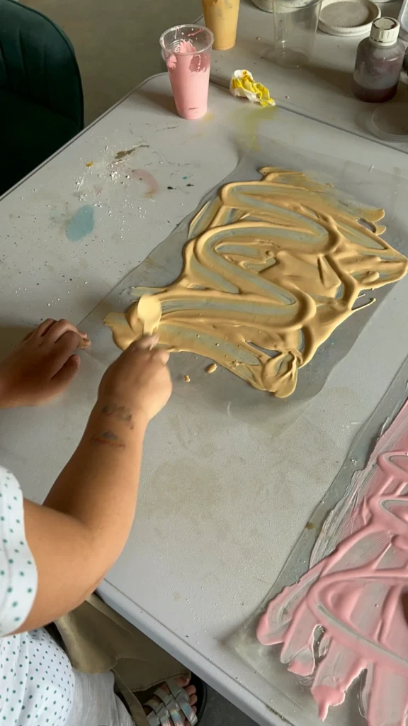 students at be creative playing with paint