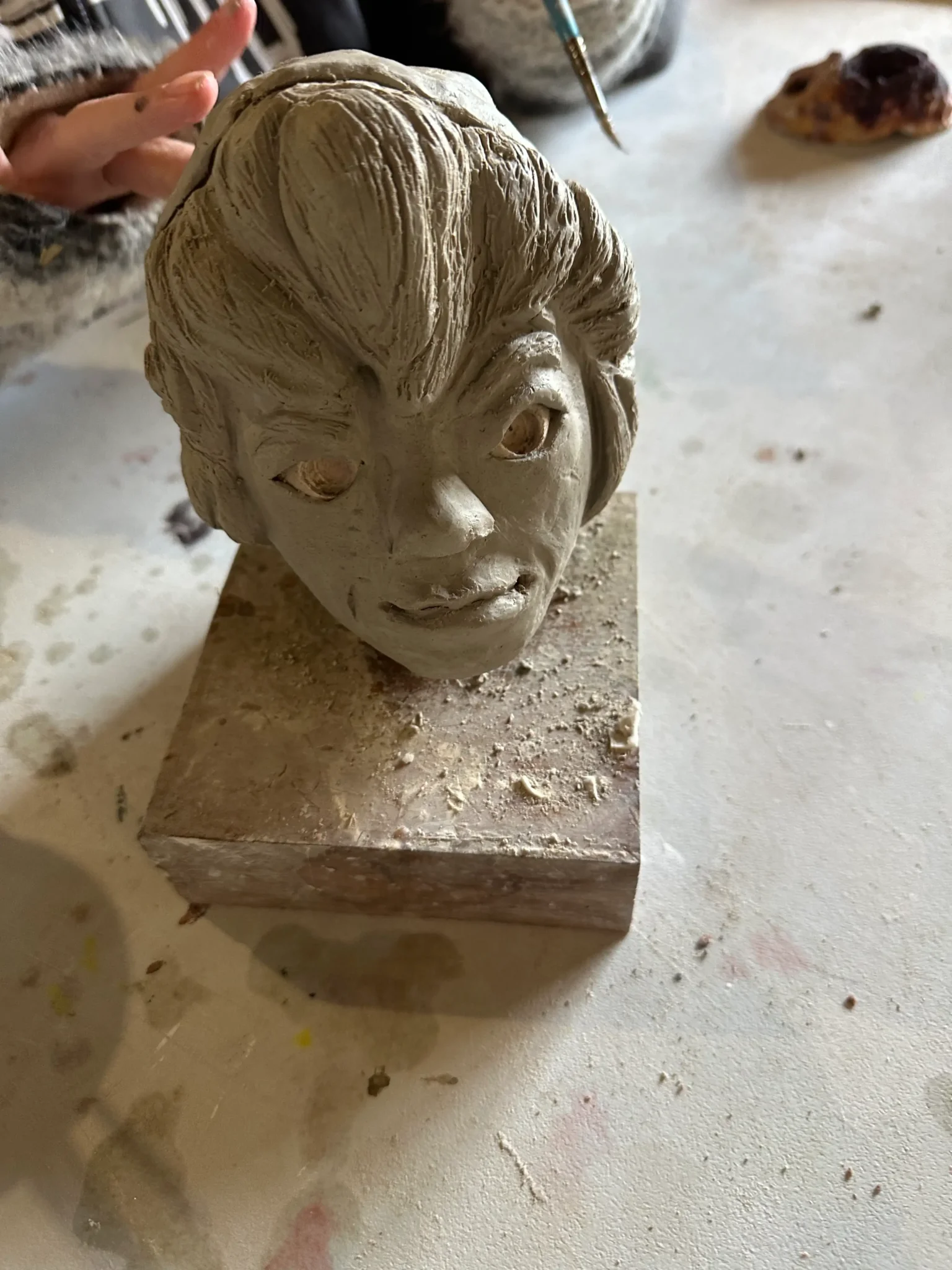 head sculpture made of clay