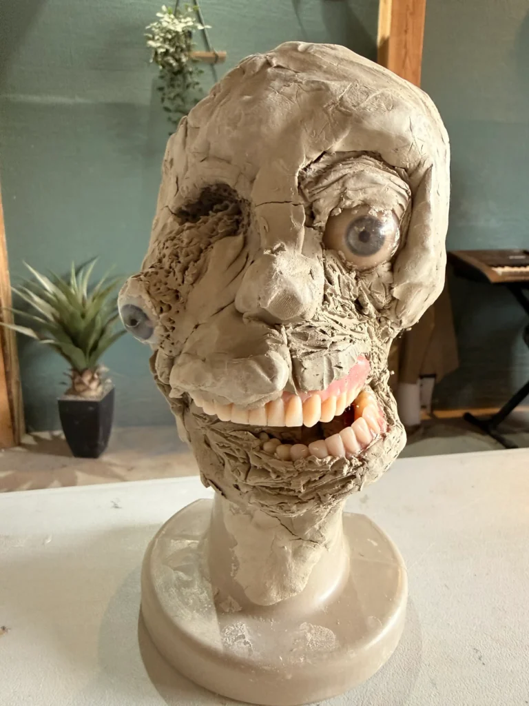 sculpture of abstract head created by students at be creative