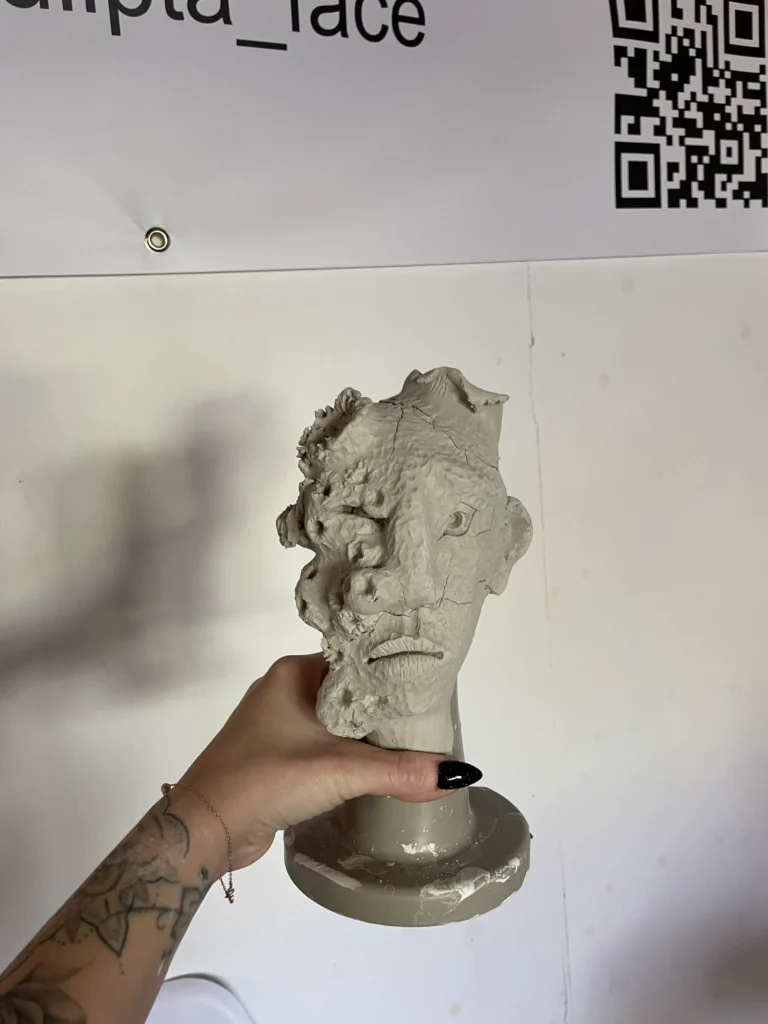 clay sculpture of a face created by students at be creative